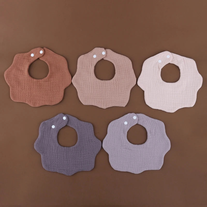 CozyCare Baby Bib | 

Soft, absorbent cotton bibs with adjustable snaps and a charming bandana design keep your baby clean and stylish during feeding time.