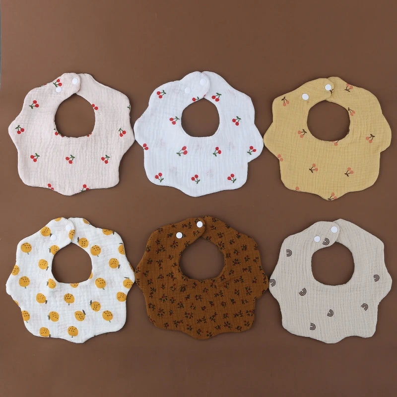 CozyCare Baby Bib | 

Soft, absorbent cotton bibs with adjustable snaps and a charming bandana design keep your baby clean and stylish during feeding time.