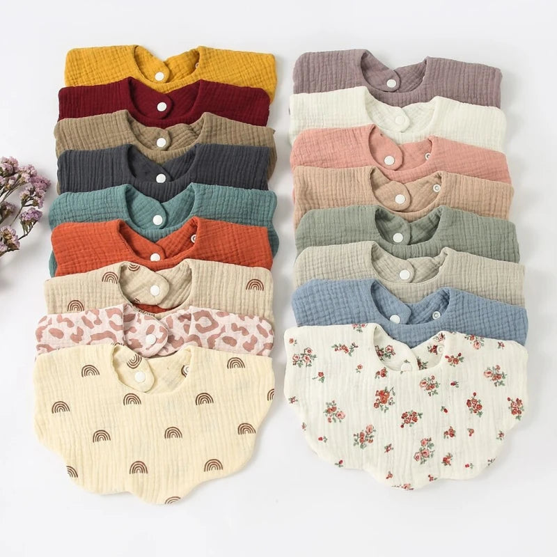 CozyCare Baby Bib | 

Soft, absorbent cotton bibs with adjustable snaps and a charming bandana design keep your baby clean and stylish during feeding time.